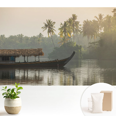 Fototapeta flizelinowa do salonu Mistyczny pejzaż z łodzią i palmami