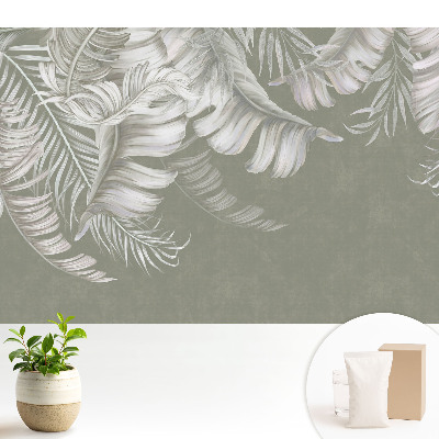 Fototapeta do salonu Subtelne liście tropikalne na szarym tle