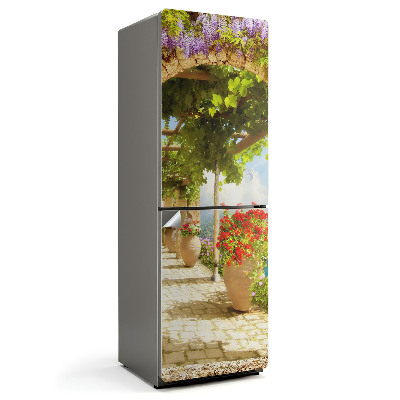 Naklejka tapeta na lodówkę Urokliwy ogród z kwiatami