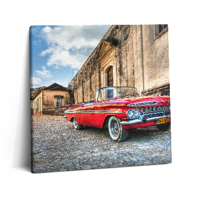 Obraz canvas 60x60 Stary czerwony samochód w dzielnicy kolumbijskiej