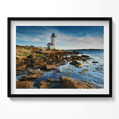 Obraz z ramką Latarnia morska, skały i pejzaż nieba