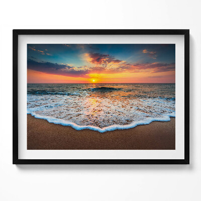 Obraz z ramką Pejzaż zachodzącego słońca nad morzem