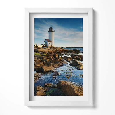 Obraz w ramie Latarnia morska, skały i pejzaż nieba