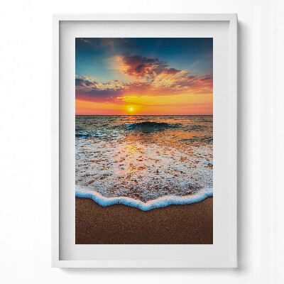 Obraz pionowy Pejzaż zachodzącego słońca nad morzem