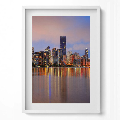 Obraz pionowy Panorama miasta nad wodą