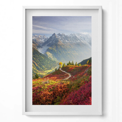 Obraz pionowy Pejzaż gór i kolorowej łąki