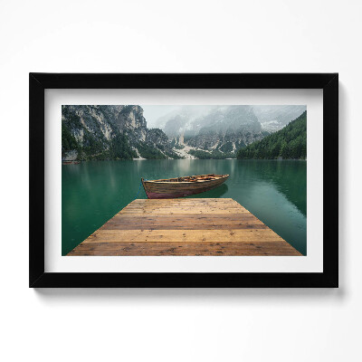 Obraz w ramie Pejzaż - molo łódka jezioro lasy i góry