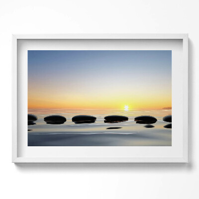 Obraz w ramie Kamienie na wodzie o wschodzie słońca - zen